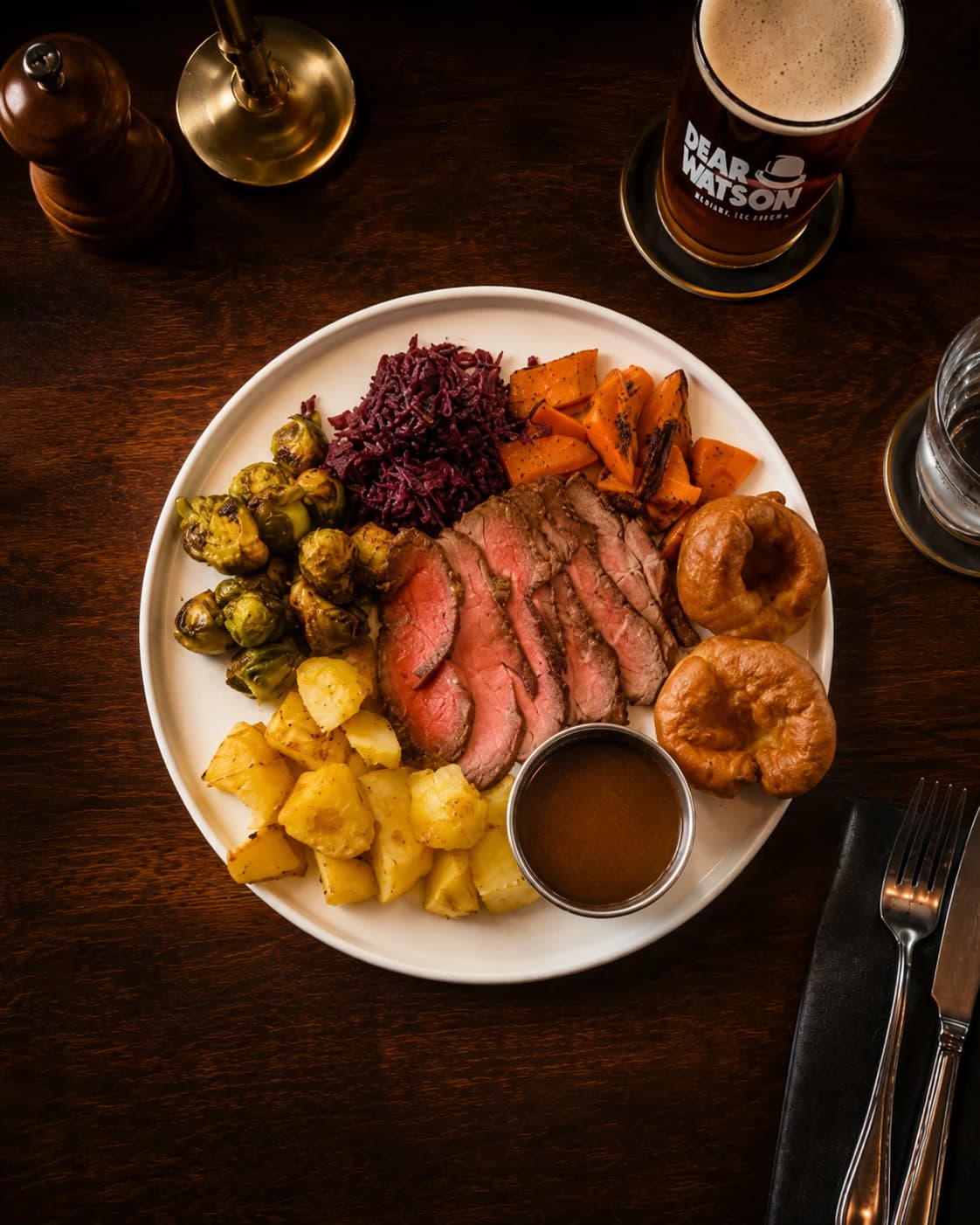 Sunday Roast plate with roast beef, vegetables, Yorkshire puddings and gravy